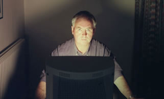 riter John Naughton pictured at home.